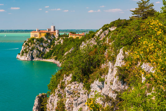 Gulf of Trieste. High cliffs Between boats, karst rocks and ancient castles. Duino. Italy
