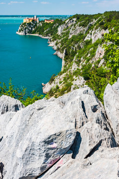 Gulf of Trieste. High cliffs Between boats, karst rocks and ancient castles. Duino. Italy