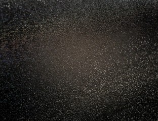 Fototapeta na wymiar Black shimmer texture. Dark glitter background. Luxury style.