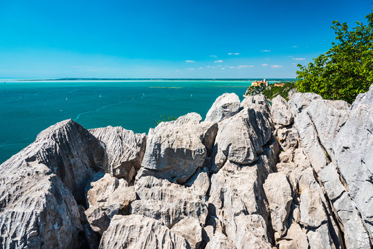 Gulf of Trieste. High cliffs Between boats, karst rocks and ancient castles. Duino. Italy