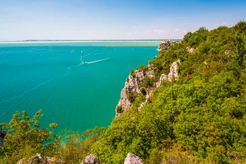 Fotobehang Gulf of Trieste. High cliffs Between boats, karst rocks and ancient castles. Duino. Italy © Nicola Simeoni