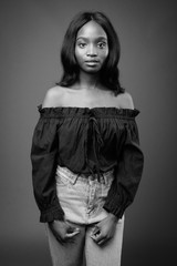 Young beautiful African Zulu woman against brown background