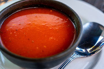 tomato soup in a ceramic bowl