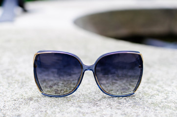 Close up with fashionable sunglasses outdoor