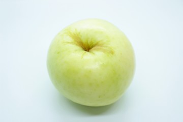 Green apple located on a white background