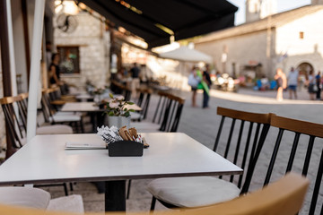 Chairs with tables in traditional Greek tavern in Greece