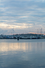 Obraz premium Calm european evening near the blue river under the sky with many clouds