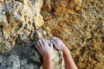 Climber's hands close-up. Mountain climbing elements.