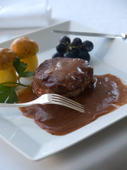 filet with silver fork and potatoes