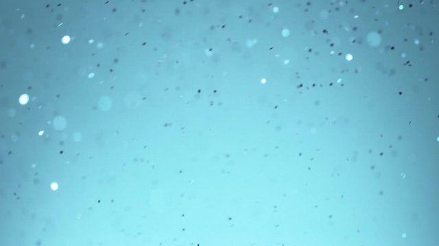 Blue Glitter Background in Super Slow Motion at 1000fps. Shooted with High Speed Cinema Camera in 4K Resolution.