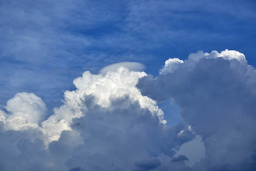 Fototapeta na wymiar A huge cloud of bizarre shape. Cloudy sky before the storm