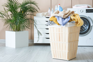 Basket with laundry in bathroom