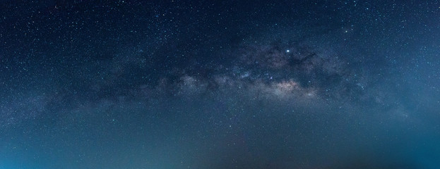 Panorama blue night sky milky way and star on dark background.Universe filled with stars, nebula and galaxy with noise and grain.Photo by long exposure and select white balance. - Powered by Adobe