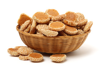Oatmeal cookies with sesame seeds on white background