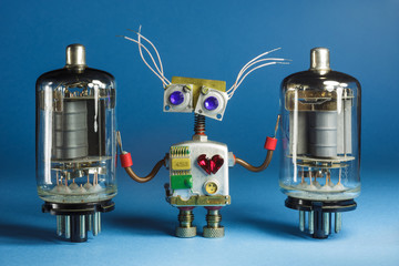 Naklejka premium Funny robot toy with vintage radio tubes.