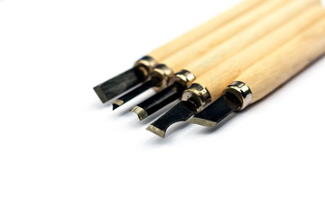 Wood carving tools on a white background.