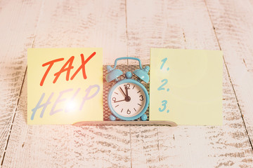 Handwriting text writing Tax Help. Conceptual photo Assistance from the compulsory contribution to the state revenue