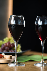Waiter pouring red wine into wineglass. 