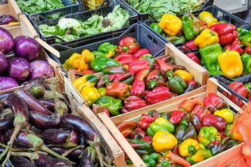 Colorful bell peppers and other vegetables for sale at a market in Naples, Itay