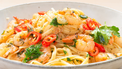 Shrimp noodles in garlic sauce with herbs and hot chili peppers