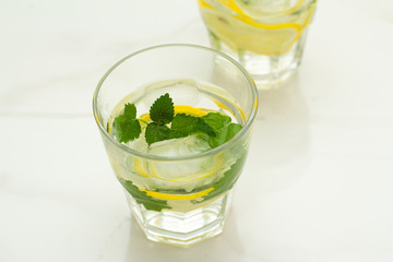 glass of water with lemon and mint