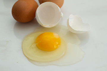 broken egg on white background