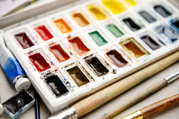 Set watercolor paints with paintbrush. Art concept