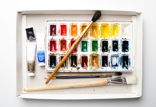 Set watercolor paints with paintbrush. Art concept