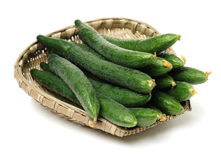 Green cucumber on the white background 