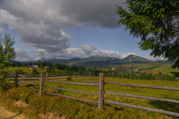 Fototapeta na wymiar rural landscape with wooden fence