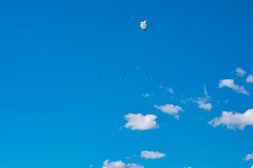 Weather anchored airship floating in cloudy sky. Air condition check. Environmental issues concept.