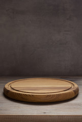 pizza cutting board at rustic wooden table