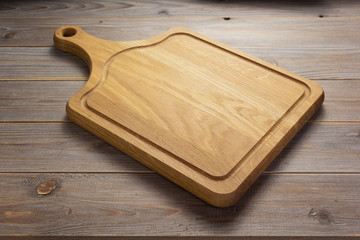 pizza cutting board at rustic wooden table