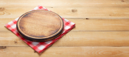 pizza cutting board at rustic wooden table