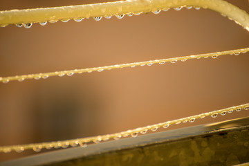 drying rack on a balcony with raindrops