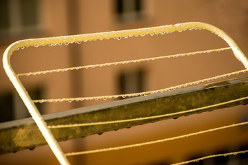 drying rack on a balcony with raindrops