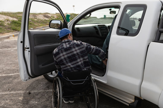 Disabled man in a wheelchair enjoying a day out