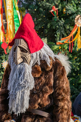 Actor dressed in traditional pagan costume of a slavic house elf, Domovoi, at Shovetide fair