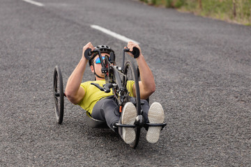 Man cycling on recumbent bicycle