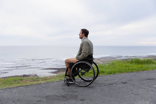 Disabled man in a wheelchair enjoying a day out