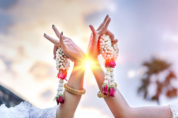 Women hands with jasmine garlands of Thailand Dancing art, Thai Classical Dance,(Ram thai) in...