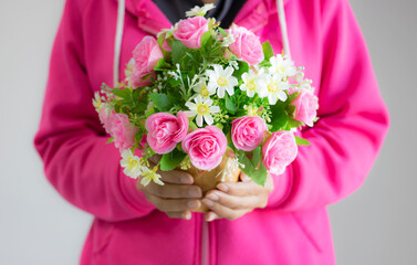 Bouquet of flowers in the hand beautiful colour for delivery to lovers. giving good feelings to each other. Pink flowers represent love and care. white represents purity.