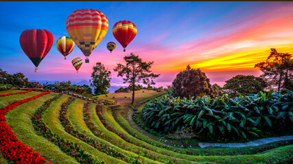 Colorful hot air balloons flying over mountains and mist in sunrise time, Huai Nam Dang National...