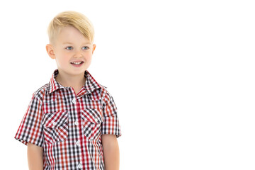 Fototapeta premium A cute little boy in a shirt and shorts.