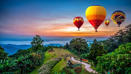 Wall murals Balloon Hot air balloons adventure in nature over winter mountain in Chiang Mai, Thailand.