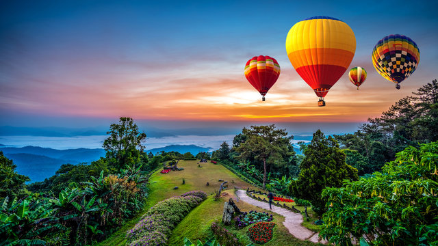 Hot air balloons adventure in nature over winter mountain in Chiang Mai, Thailand.
