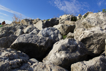 messy big rocks of mountain landscape with blue sky and white clouds powerful nature