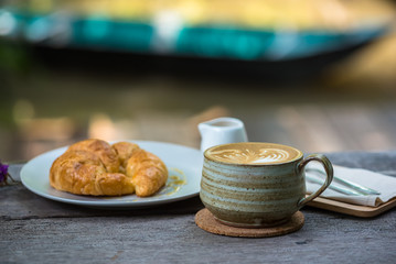 Breakfast with coffee and croissants on the garden terrace