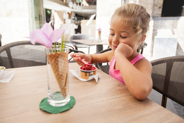 Cute Little Girl Eating Ice Cream Outdoor Cafe
