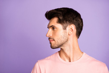 Fototapeta premium Close-up profile side view portrait of his he nice attractive lovely cute calm content bearded brunet guy wearing pink tshirt looking aside isolated over violet purple lilac pastel color background